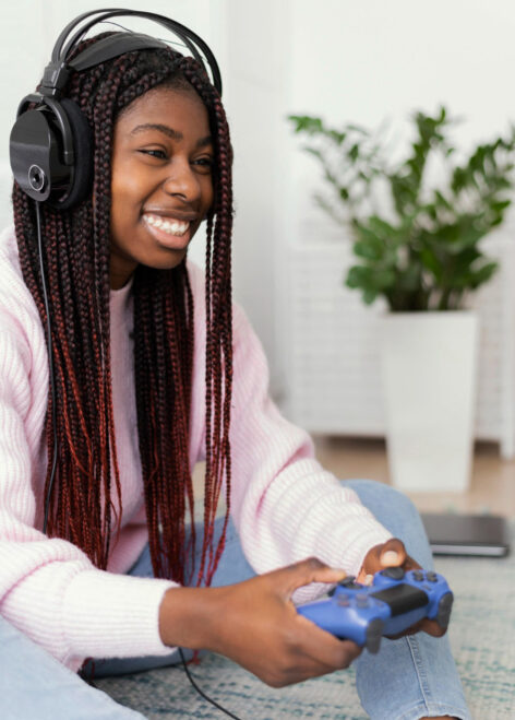 woman is happy while playing video game